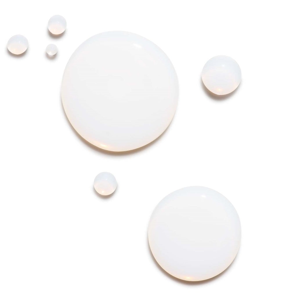 Liquid drops of Barrier Booster Orange Ferment Vitamin C Essence.
