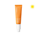 Open bottle of Banana Bright™ Face Primer. Upper right corner has an icon of a yellow sun.
