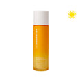 Closed bottle of Barrier Booster Orange Ferment Vitamin C Essence. Upper right hand corner has an icon of a yellow sun.