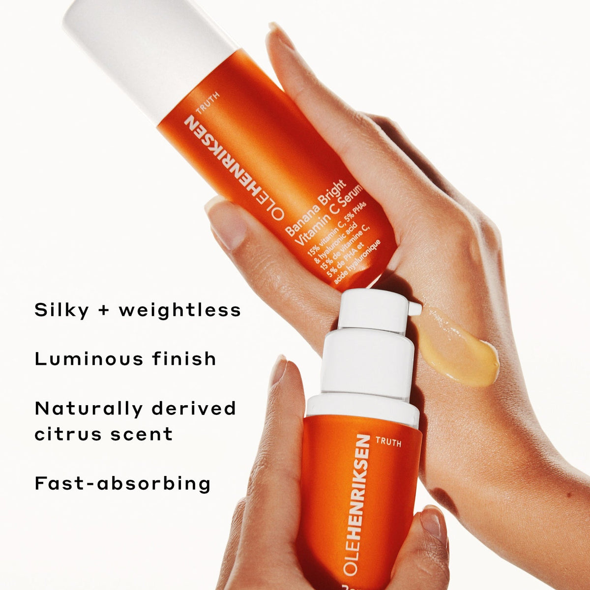 Stylized image of two hands holding Banana Bright Vitamin C Serum bottles. One hand has the bottle against the other hand with a smear of the serum on the hand. It reads: Sily + weightless. Luminous finish. Naturally derived citrus scent. Fast-absorbing, against a white background.